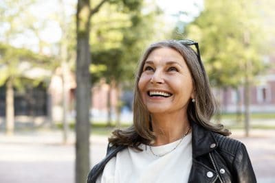 mature senior woman outside smiling