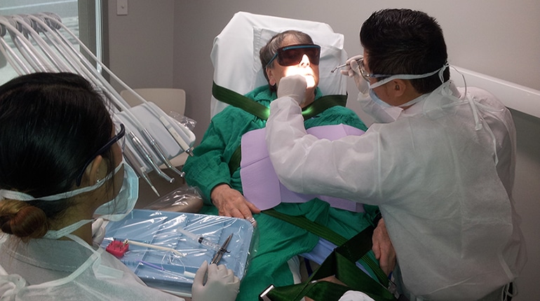 Dr. Lee doing a dental procedure