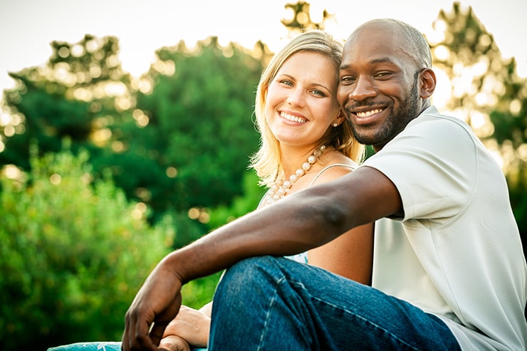 Happy couple showing off their straight teeth