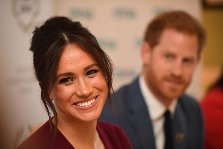 Britain's Meghan, the Duchess of Sussex, and Prince Harry, Duke of Sussex, attend a roundtable discussion on gender equality with The Queen's Commonwealth Trust (QCT) and One Young World at Windsor Castle. Her smile makes headlines everywhere she goes!