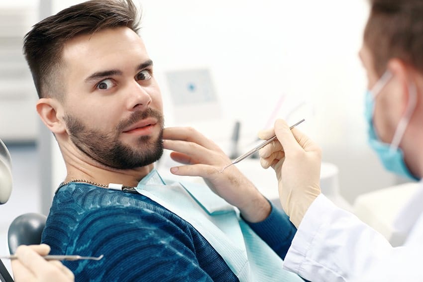 man with anxiety prepares for a dental procedure