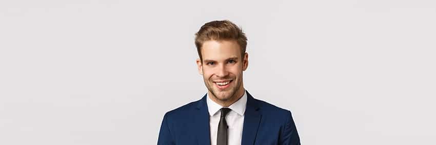 handsome businessman in suit shows off his smile