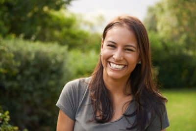 adult woman smiling with teeth