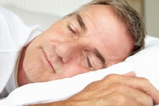 Middle aged man sleeping.