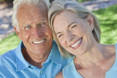 Close up of a happy, older couple at the park.